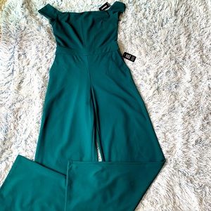 Green bell bottom jumpsuit.
